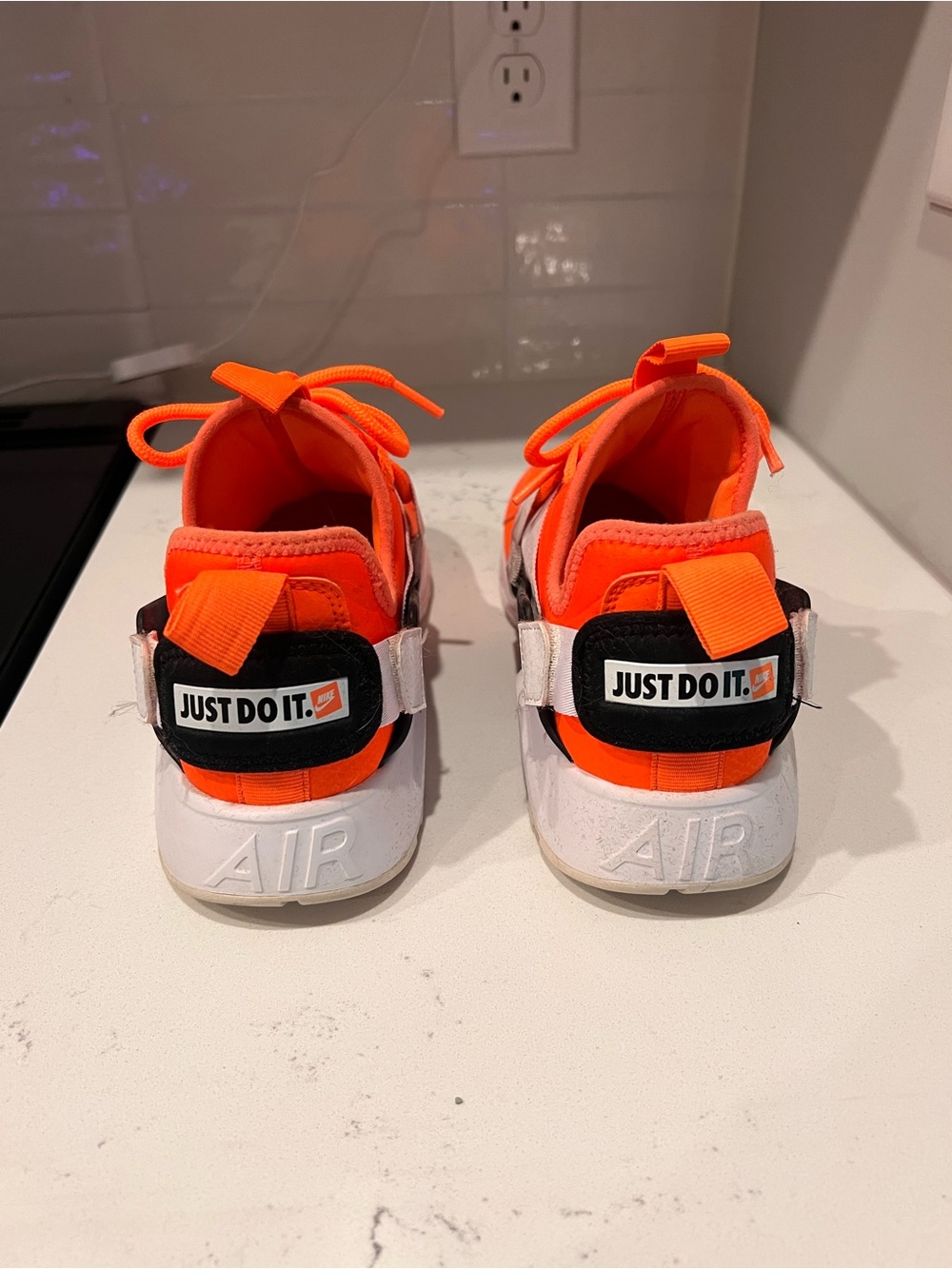 Nike Kids Sneakers in Bright Orange and White with 'Just Do It.' Heel Strap